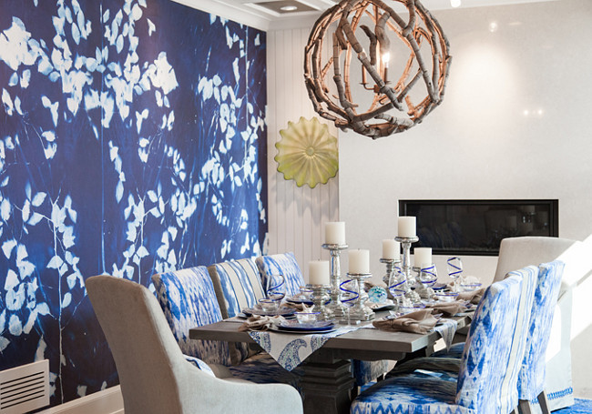 Dining room. Dining room with blue and white wall mural by Area Environments and driftwood orb chandelier by Currey & Company. #CurreyandCompany #OrbChandelier #Driftwood #Mural #Diningroom Wall color is Benjamin Moore White Dove. Great Neighborhood Homes.