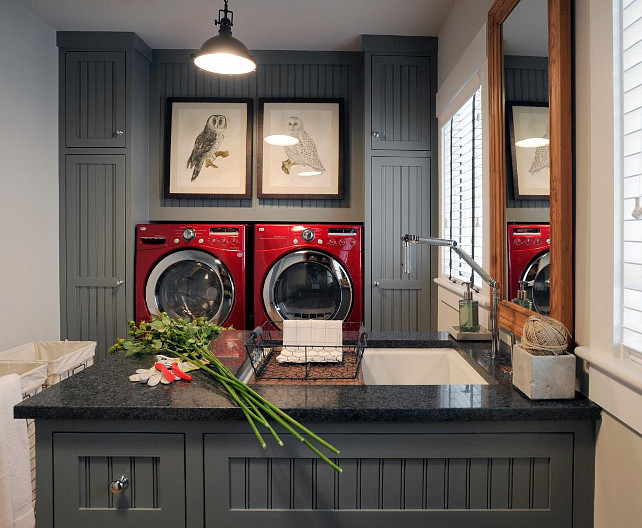 Laundry room. Charcoal laundry room cabinet paint color. Laundry room with charcoal gray cabinets and eco-friendly CaesarStone countertop. #LaundryRoom #CharcoalGray #Cabinet #Paintcolor #LaundryRoomIdeas MacKenzie Brothers