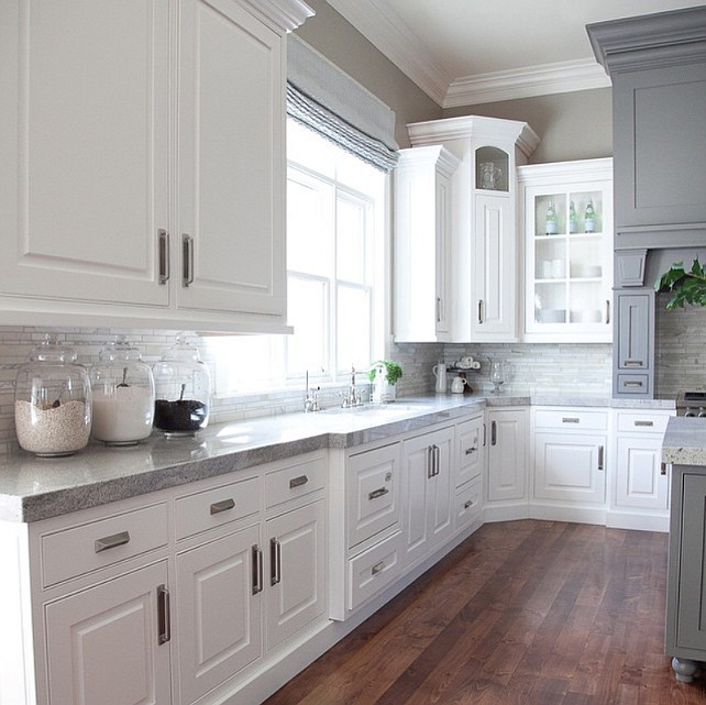White and gray kitchen countertop. The gray is Benjamin Moore Dolphin. The counter in this white and gray kitchen are Delicatus Granite. #DelicatusGranite #WhiteGrayKitchen #BenjaminMooreDolphin Alice Lane Home Collection