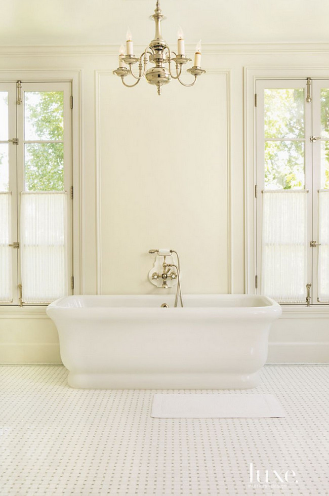Freestanding Bath Pictures. The master bath’s Empire tub is appointed with the Astoria tub filler, both by Waterworks. A 19th-century French silver-plated chandelier from Tod Carson illuminates the space. The basket-weave flooring is also by Waterworks. Karen Putman.