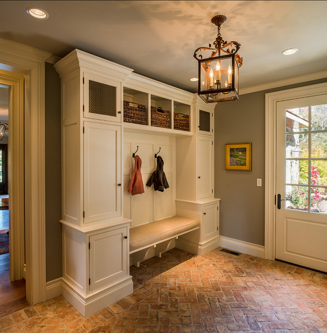 Mudroom. This Mudroom is just Perfect! Great Flooing and Storage space! #Mudroom #InteriorDesign Cabinet & Trim Paint Color: Benjamin Moore Acadia White OC-38