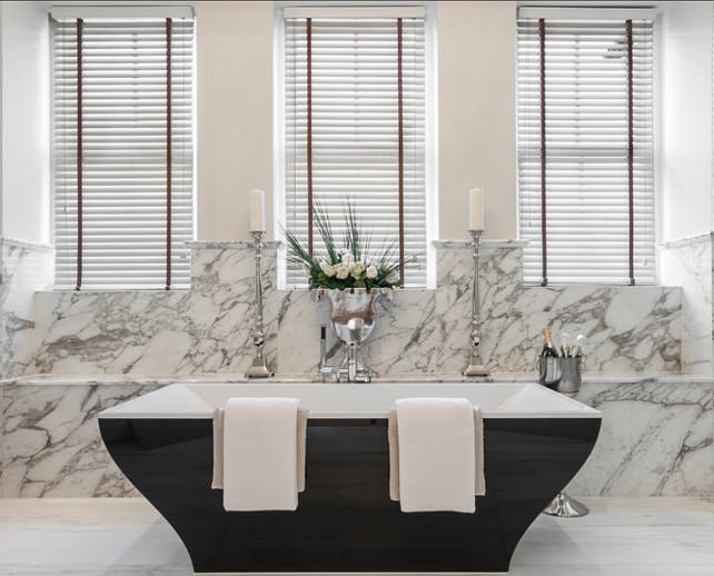 Bathroom Design Ideas. This is a stunning bathroom, from its marble flooring and backsplash to this unique freestanding bathtub. #Bathroom #BathroomDesign