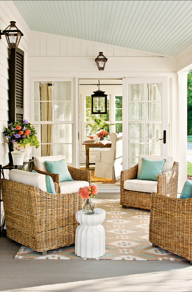 Patio decorating ideas. Rugs define the dining room as a separate area from the connecting kitchen and ground the arrangement of chairs on the patio. #Patio Ceiling Paint Color: Sherwin-Williams SW6210 Window Pane