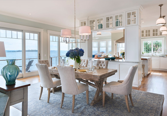 Dining Room. Coastal home dining room with Restoration Hardware linen tufted dining chairs and farmhouse table. #linen #tufted #diningchairs #Coastal #DiningRoom Davitt Design Build, Inc. Nat Rea Photography.