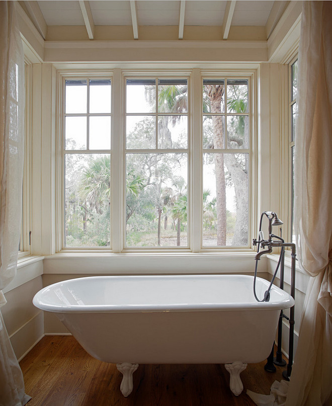 Bath Nook with Sheer Curtains. Master bathroom with clawfoot tub in nook with hardwood floors and sheer curtains. #Bathroom #BathNook #Bath #Nook #SheerCurtains #BathroomCurtains Wayne Windham Architect, P.A. Interiors by Gregory Vaughan, Kelley Designs, Inc. Photos by Atlantic Archives, Inc. 