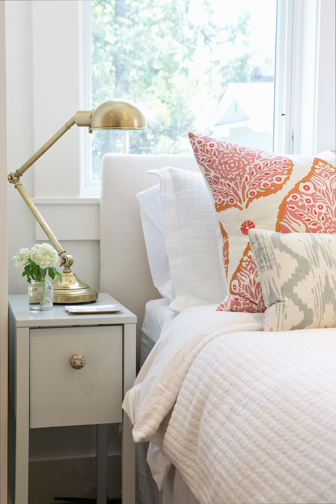 Bedroom Ikea Nighstand. Bedroom Ikea Nighstand and Anthropology knob. The designer added an inexpensive Ikea nightstand, painted it with Benjamin Moore Palladian Blue in gloss and finished with fun brass knobs. Lamp is Robert Abbey Kinetic Antique Brass Pharmacy Desk Lamp. Braun + Adams Interiors. 