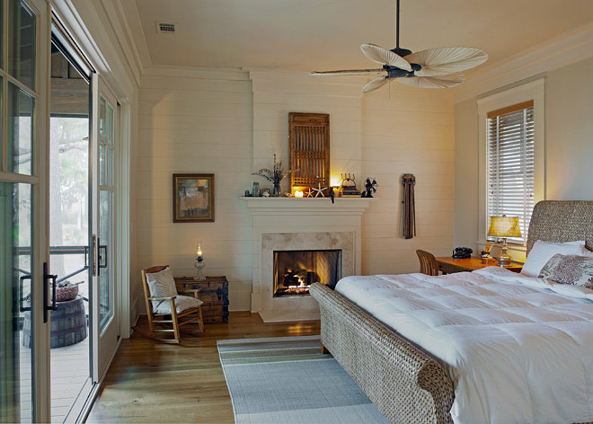 Neutral Master Bedroom. This neutral master bedroom fireplace features a plank wood fireplace, plank wood paneling walls and hardwood floors. Sliding patio doors leads you to a screened patio. Neutral master bedroom decor. Neutral master bedroom paint color. #Neutral #masterbedroom Wayne Windham Architect, P.A. Interiors by Gregory Vaughan, Kelley Designs, Inc. Photos by Atlantic Archives, Inc. Interiors by Gregory Vaughan, Kelley Designs, Inc. Photos by Atlantic Archives, Inc. 