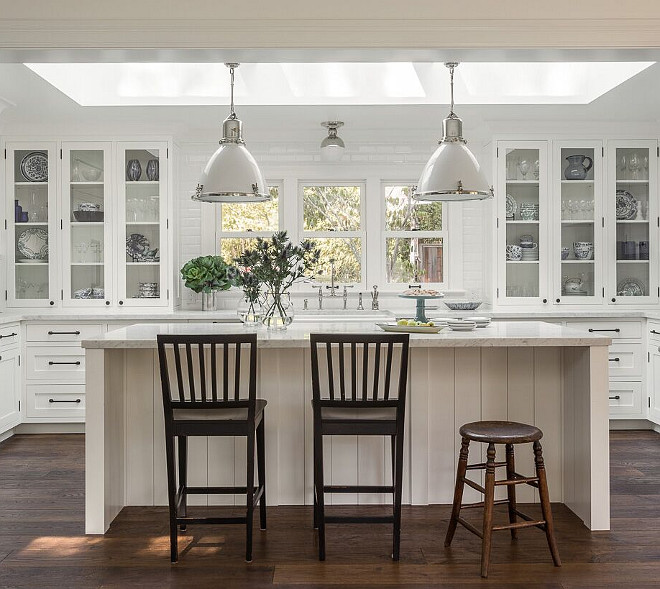 Kitchen Lighting. The pendants over the island are the Ralph Lauren Fulton Medium Pendant in polished nickel with white ceramic. The light over the sink is the Clark Ceiling Light, also in polished nickel. #kitchen #lighting Heydt Designs.. 