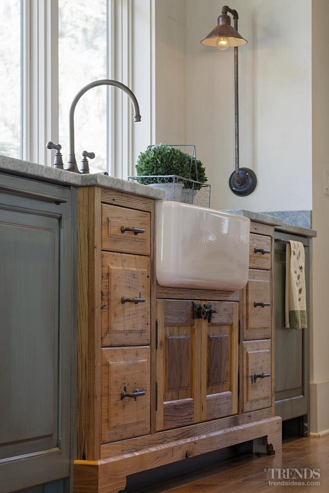 Kitchen Farmhouse Sink. The sink cabinet juts out into the room, like a piece of furniture that has been converted for use in the kitchen. The farmhouse sink is Rohl RC3018 - Biscuit Shaws Apron Front from Ferguson. Kitchen faucet is Perrin & Rowe English Bronze Bridge Style. Picture via Kitchen TRENDS. Interiors by Gregory Vaughan, Kelley Designs, Inc. Photos by Atlantic Archives, Inc. 