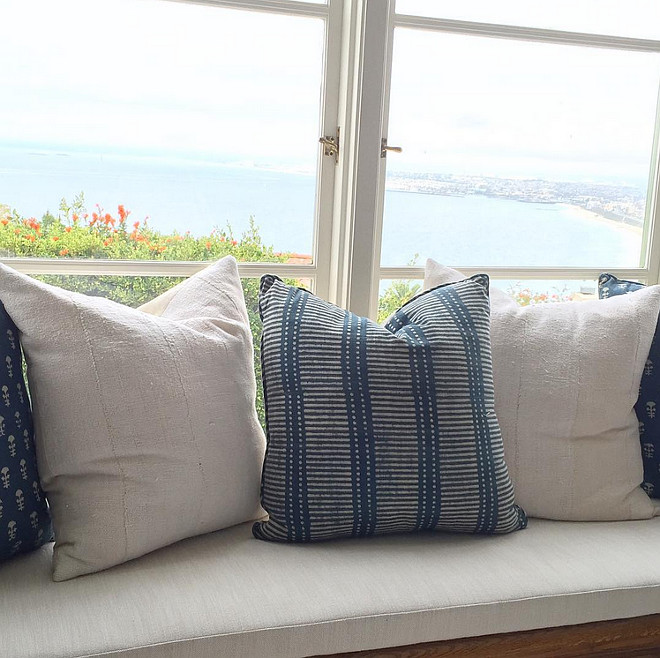 Ocean view window seat inspiration. Window seat with ocean view and coastal pillows. Rita Chan Interiors.