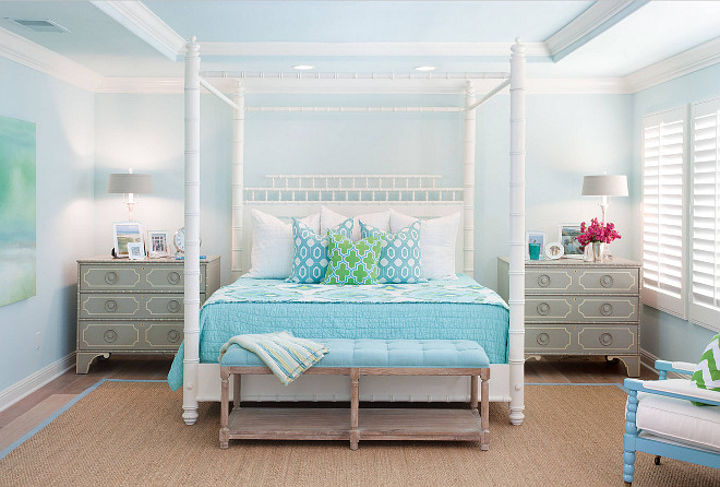 Coastal Bedroom. Coastal Turquoise Bedroom. Coastal turquoise bedroom features a white faux bamboo canopy bed with pagoda headboard dressed in green and blue bedding flanked by gray nightstands, Somerset Bay Big Pine Key Chests, alongside a turquoise blue tufted bench placed at the foot of the bed atop a turquoise blue bound sisal rug. Bedding is from Nordstrom Home, the back two accent pillows are from Zgallerie and the front accent pillow is from Wisteria.