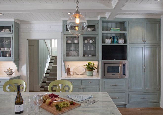 Floor to ceiling subway tile backsplash. This kitchen features floor to ceiling white subway tile backsplash and coffered ceiling painted in White Dove by Benjamin Moore. The white coffered ceiling is painted in White Dove by Benjamin Moore. #kitchen Kim Grant Design Inc.