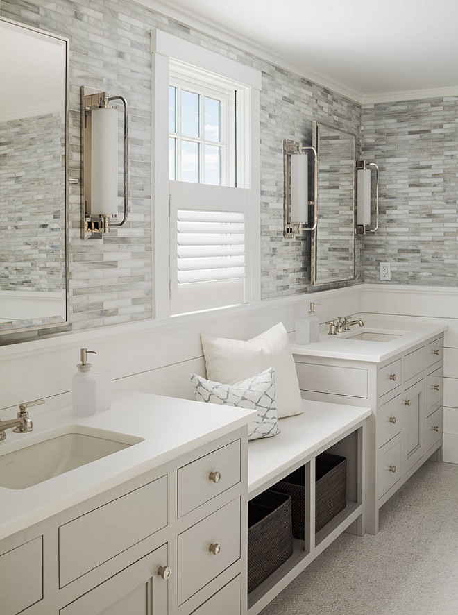 Bathroom with shiplap and wall tiles. Bathroom with white shiplap wall and tiles. Bathroom with shiplap and tile walls. A window seat is flanked by the his and hers sinks. #Bathroom #Shiplap #Tile #wall Sophie Metz Design.