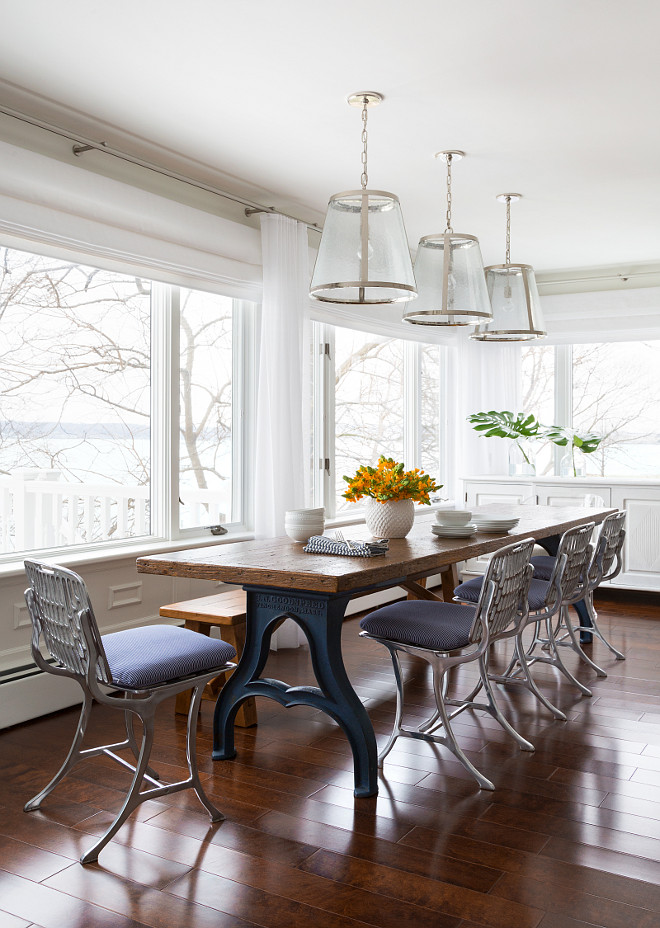 Industrial Dining Room Ideas. Perfect spot for a Sunday family lunch don't you think? Pendants above the dining table are from Lighting Direct. The industrial table was purchased from an antique dealer in Connecticut. The industrial chairs are limited in quantity but can sometimes be found on 1st Dibs. They are molded metal chairs made with the molds of 1930's Paris metro chairs. The chair cushions are made custom.