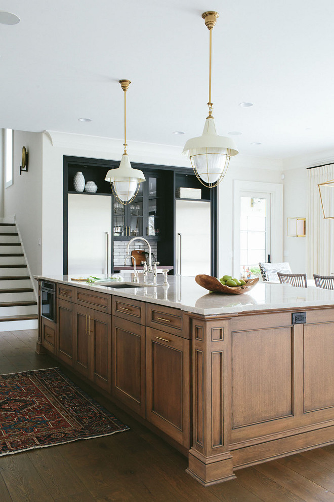 Kitchen island. Stained wood kitchen island. Stained wood kitchen island with white and brass pendants. Stained wood kitchen island. #Stainedwoodkitchenisland #kitchenisland #woodkitchenisland #island #woodenisland stainedwoodisland Kate Marker Interiors. 