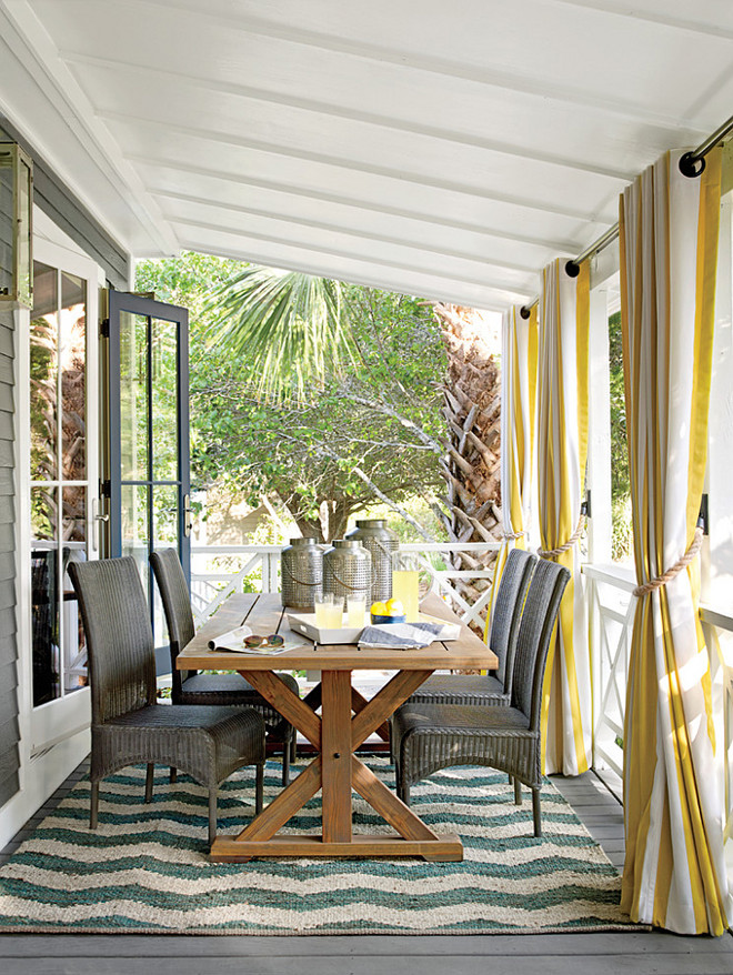 Dining Porch. Dining Porch Ideas. The porch base is painted Kendall Charcoal, the floor is painted Chelsea Gray, and the ceiling is painted Cloud Cover, all by Benjamin Moore. The furniture is by Lloyd Flanders, and the fabrics and throw are by Sunbrella. #DiningPorch