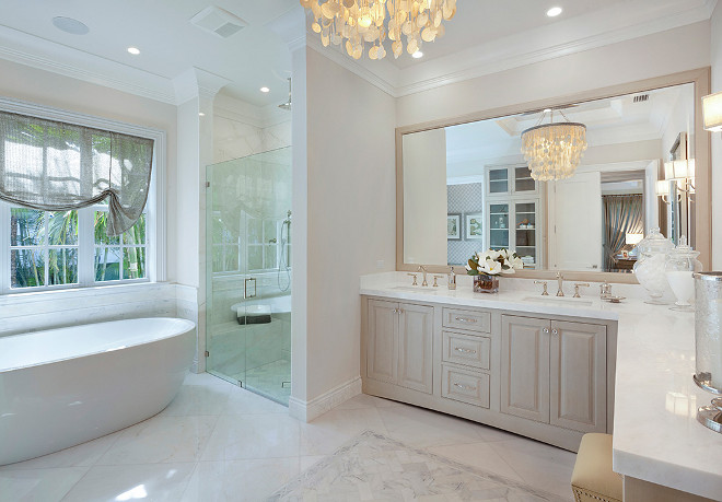 Bathroom. Neutral bathroom. Neutral, soft, transitional master bathroom with a sheer roman shade, Made Goods Henry Capiz Chandelier and marble counters. #Bathroom #Neutralbathroom