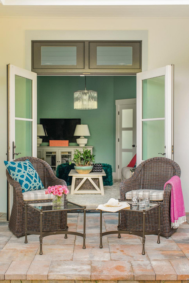 French Doors. A pair of French doors open the media room up to a side yard with seating area that fits perfectly with the indoor-outdoor Floridian lifestyle.