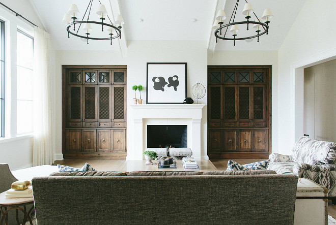 Living room Cabinets flanking fireplace. Stained wood cabinets flanking fireplace in living room. #livingroom #fireplacecabinets #stainedwoodcabinet Kate Marker Interiors.