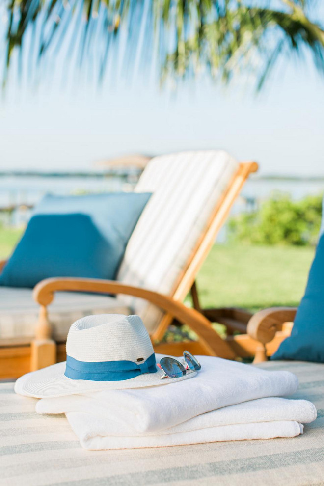 Pool Furniture. Fresh white towels, a wide-brim sun hat and dark shades allow friends and family to sit for hours on the lounge chairs on the sun deck.