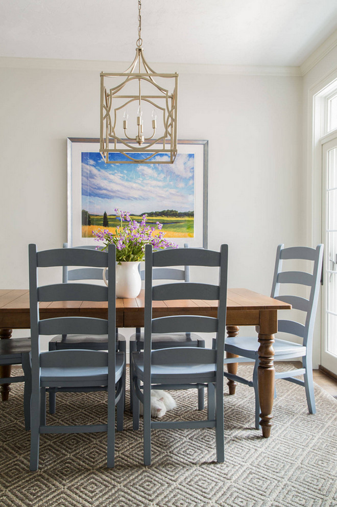 Update the tired look of your old chairs with fresh paint. The designer painted the old chairs from Pottery Barn with a gray paint by Benjamin Moore. #PaintedChairs