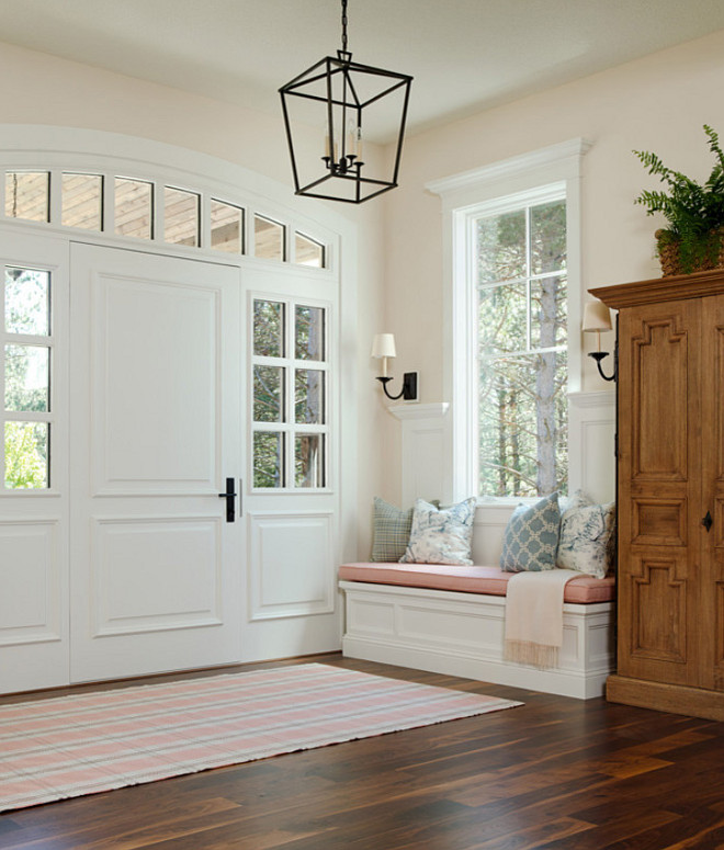 Foyer Decor and color palette ideas, Foyer decorated in neutral colors, pale pink and gray rug by Dash and Albert, blue and white pillows and neutral wall paint color Benjamin Moore White Down OC-131 #Foyer #Foyerdecor #Foyercolorpalette #PalePink #Pinkgray #GrayandPink #BenjaminMooreWhiteDownOC131