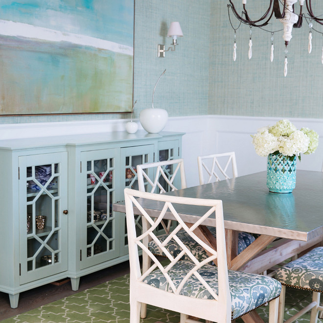 Turquoise Sideboard accented with trellis glass doors, Dining room with Turquoise Sideboard accented with trellis glass doors, blue grasscloth wallpaper and white waiscoting on walls #Diningroom #turquoisesideboard #sideboard #trellis #grasscloth #wainscoting Waterleaf Interiors