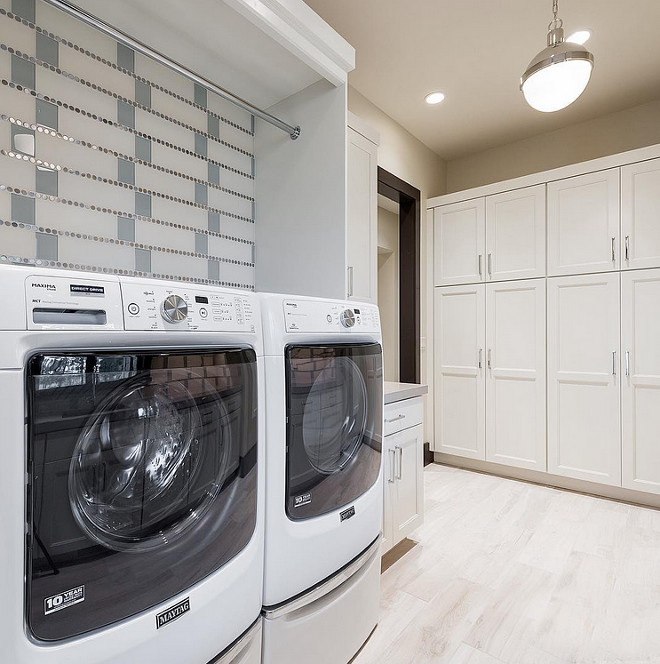 Laundry Tiles. Laundry room tile ideas. Laundry room features glass tile and stainless penny round combo. Laundry Room Tiling. #Laundryroom #LaundryroomTiles #LaundryroomTileCombo #LaundryroomTileIdeas #LaundryroomTiling Sita Montgomery Design