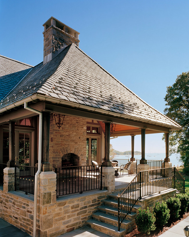 Outdoor Rooms, Well-suited for outdoor entertaining, the Family Room Porch is outfitted with a fireplace and cedar cathedral ceiling supported by reverse taper columns of solid reclaimed timber #OutdoorRooms Douglas VanderHorn Architects 