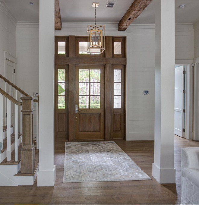 Foyer exposed wood beams and shiplap walls. Foyer exposed wood beams and shiplap walls painted in White Dove by Benjamin Moore. 30A Interiors