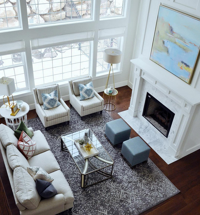 Living room with tall fireplace room furniture and decor layout. Sita Montgomery Design