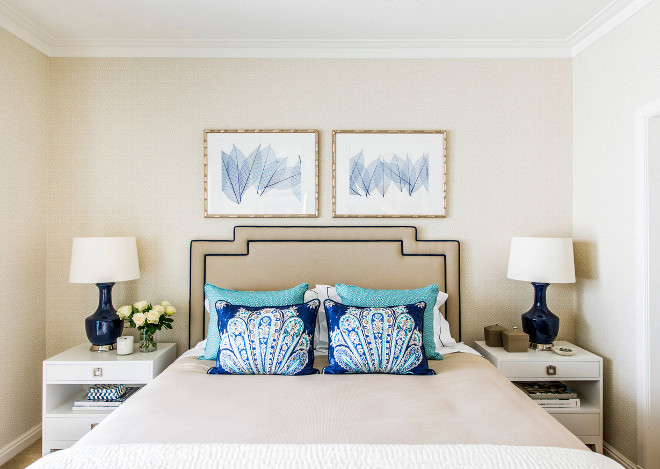 Small Bedroom. Small Bedroom feautures a queen bed, neutral wallpaper, blue and white art above bed and a pair of white nightstands. Small Bedroom Ideas #Smallbedroom Highgate House