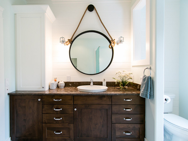 These full overlay maple cabinets are from Brookhaven (a Woodmode product) - the wall cabinet is painted Nordic White and the vanity is finished in their Dark Lager stain. BAC Design Group