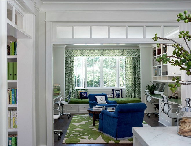 This home office off the kitchen acts as a control center for the family. Kids work on computers in open spaces, not in their rooms. The window seat is a sunbrella velvet for durability and the chairs swivel to 'talk' with the kitchen