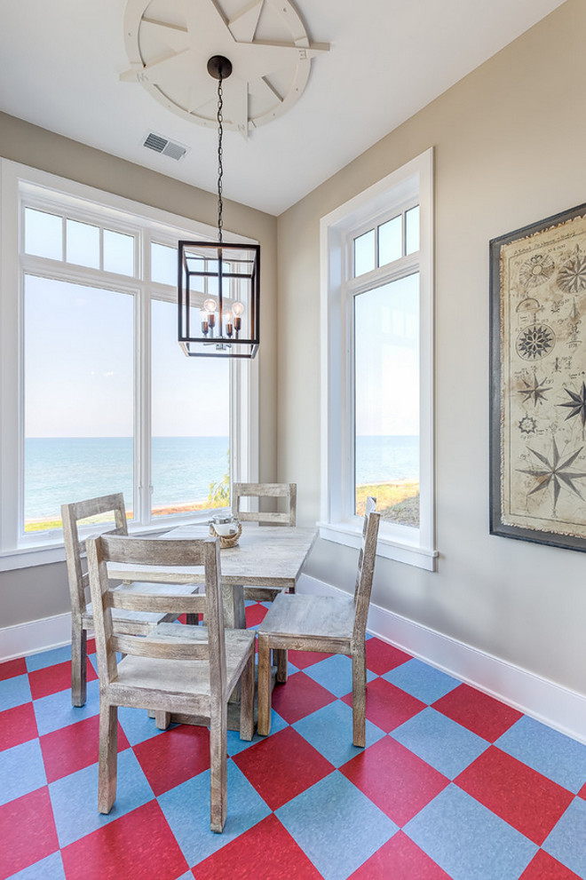 Leading straight to the beach, this cheerful refreshment area boasts checkered floors, industrial lighting and compass-themed coastal décor that sets a playful tone and makes for the perfect spot to watch the sun set over the lake. Mike Schaap Builders