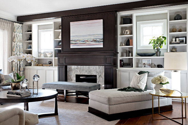 Chic Family Room. Family Room features paneled fireplace flanked by large built in bookcases. Family Room designed by Elizabeth Metcalfe Interiors & Design Inc. #FamilyRoom