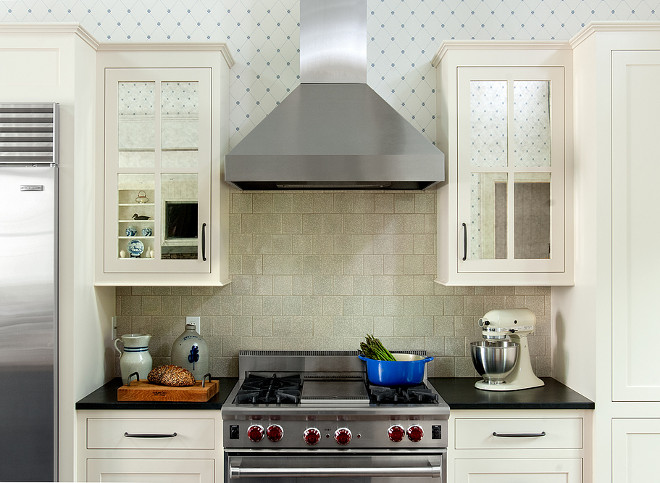 The kitchen features 6" x 6"crackle subway tile backsplash and soastone countertop. #cracklesubwaytile #soapstone