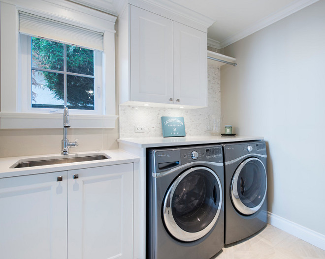 Laundry Room. Laundry Room. White laundry room cabinets with gray washer and dryer. Wall paint color is Collingwood OC-28 Collingwood Eggshell Benjamin Moore. #Laundryroom Kemp Construction. Sarah Gallop Design Inc.