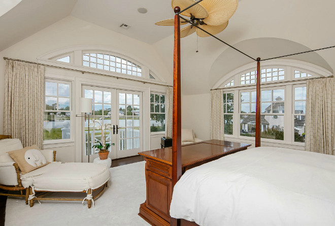 Traditional Bedroom with arched window transoms. Christie's Real Estate