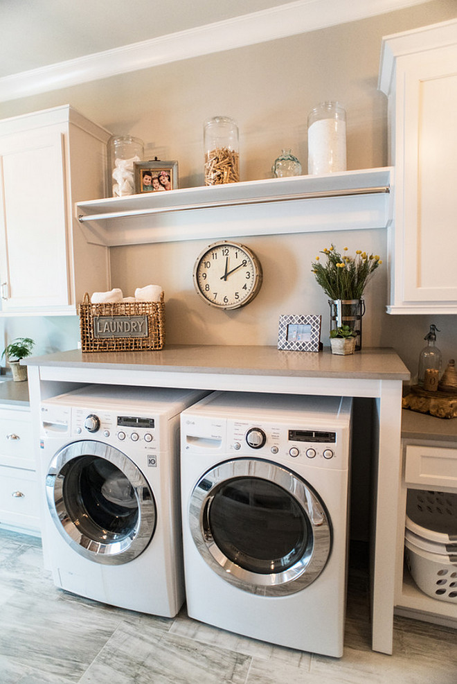 Laundry Room. Laundry Room. Laundry Room combines white cabinet with gray quartz countertop and porcelain floor tiles. Laundry Room Paint color is Sherwin Williams Silverplate. #LaundryRoom #LaundryRoomIdeas #LaundryRooms #LaundryRoomdesign Distinctive Remodeling Solutions, Inc Artisan Design Studio