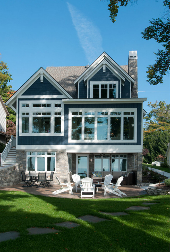 The exterior sets the tone for the coastal style that features durable fiber cement siding that will withstand the lakeshore elements, painted a unique shade of nautical blue with contrasting white trim. Michigan’s own Black River Ashlar and a standing seam roof done in champagne metallic further accentuate this waterfront home.