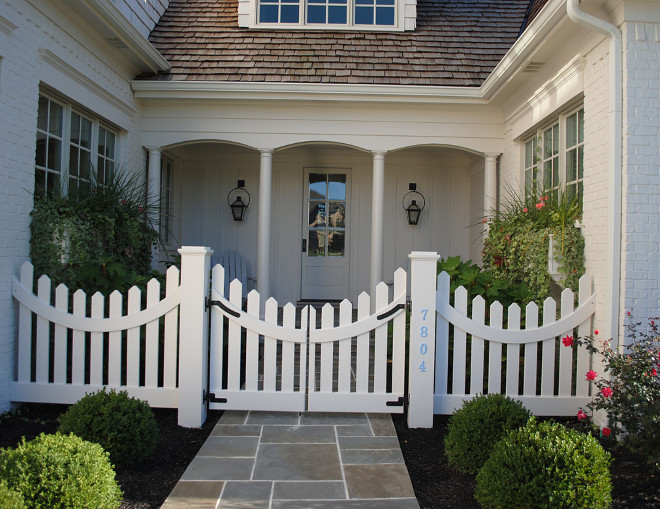 Courtyard with white picket fence and Bluestone patio tiles. #Courtywar #picketfence #whitepicketfence #Bluestone Stacye Love Construction & Design, LLC