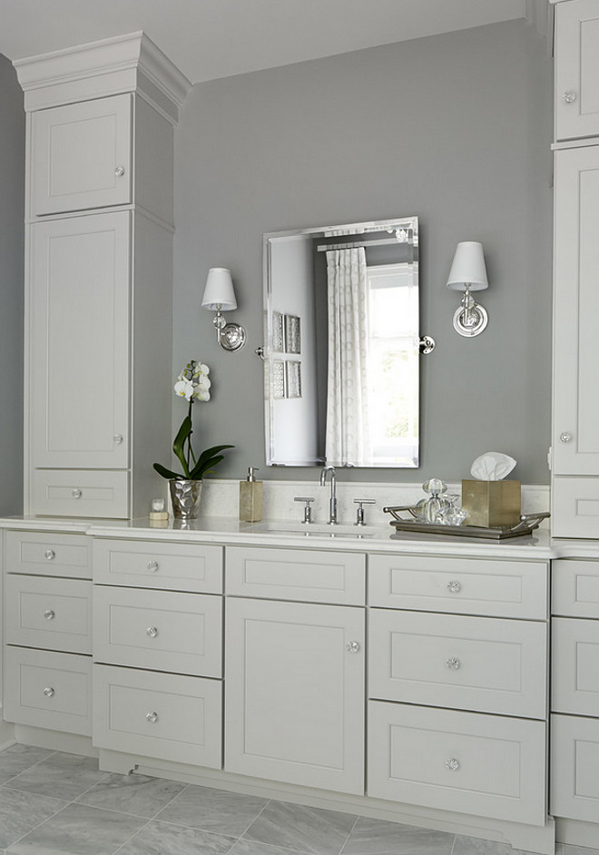 Gray bathroom with pale gray cabinet. Summit Signature Homes, Inc