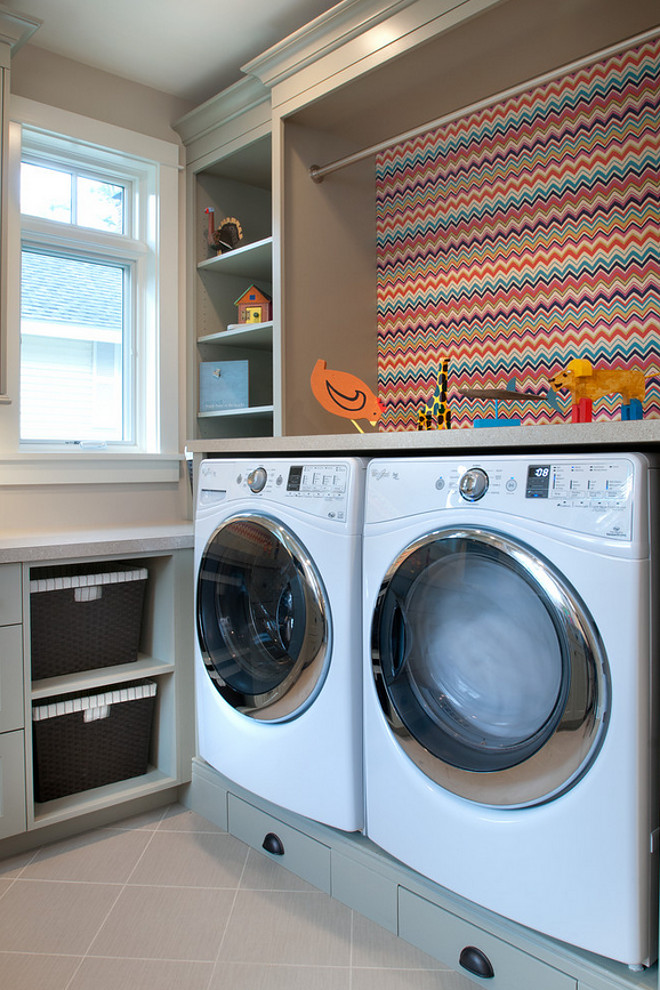 Laundry Room. Laundry Room Ideas. Laundry Room features gray cabinets and a colorful chevron wallpaper behind washer and drawer. #laundryroom #wallpaper #chevronwallpaper.