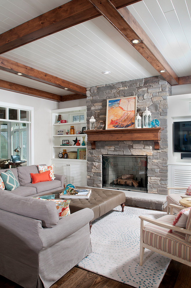 Living room fireplace. Coastal living room with stone fireplace. Stone fireplace in living room. #Livingroom #Stonefireplace #CoastalLivingroom #StonefireplaceLivingroom