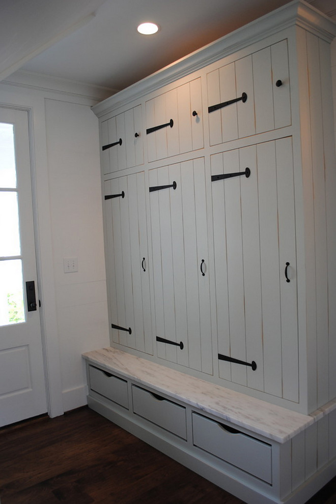Mudroom Cabinet. Custom mudroom cubby cabinet with strap hardware by Acorn. Bench seat is made of honed Imperial Danby. #Mudroom #MudroomCabinet #Cabinet Stacye Love Construction & Design, LLC