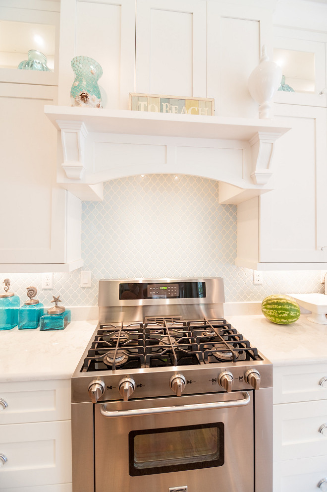 Mini Arabesque Tile. Kitchen features white cabinets with blue Mini Arabesque Tile. Mini Arabesque Tile. Mini Arabesque Tile Backsplash #MiniArabesqueTile #BlueMiniArabesqueTile #Kitchenbacksplashtile Strickland Homes