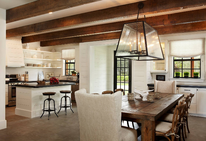 Rustic kitchen with tongue and groove cabinets and tongue and groove walls. Kitchen ceiling features reclaimed wood beams. #kitchen #rustickitchen #tongueandgroove #shiplap #kitchentongueandgroove #cabinets #walls #reclaimedceiling Giana Allen Design LLC.