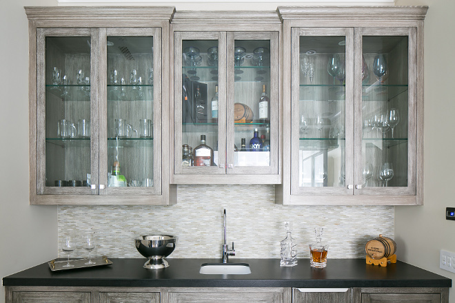 Wet Bar. Wet Bar Butlers pantry cabinet. The wet bar features reclaimed white oak cabinets and honed black granite countertop. #wetbar #bar #reclaimedwoodcabinet #whitewashcabinet #whiteoak #honedblackgranite Patterson Custom Homes. Brandon Architects, Inc.