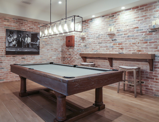 Games room. Exposed brick walls bring a rustic feel to this games room. #Gamesroom #exposedbrick Patterson Custom Homes. Interiors by Trish Steele, Churchill Design.